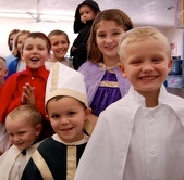 Children wearing saints costumes.