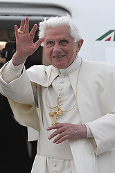 Pope Benedict XVI waves goodbye as he boards his plane at Birmingham airport in England Sept. 19.