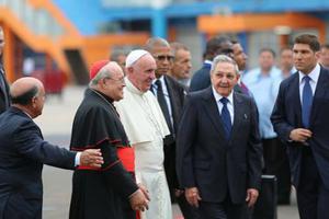 Pope Francis is greeted by Cuban President Raul Castro and other officials upon his arrival in Havana on Sept. 20. 
