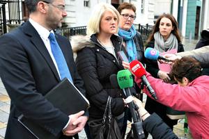 Amnesty International supported Sarah Ewart, pictured with her lawyer outside Belfast Magistrates' Court in Northern Ireland on Dec. 16, in her legal bid to abort her child after it was diagnosed with anencephaly.