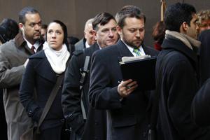 People wait in line for a job fair in New York's Times Square.