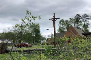 A crucifix outside a Tennessee church after storms over Easter, 2020. 