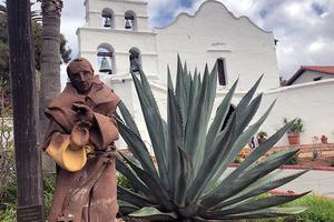 ABOVE: Exterior of the Mission Basilica San Diego de Alcalá, with a statue of St. Junípero Serra. INSET: Exterior of the mission. BELOW: A model of the mission house where St. Junípero stayed; an example of native dwellings; a 19th-century photo of the mission; and photos of the interior and exterior of the mission.
