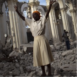 A woman prays amid the rubble of the damaged main cathedral in downtown Port-au-Prince, Jan. 9. Haiti is marking the first anniversary of the earthquake that killed around 250,000 people and wrecked much of the capital Port-au-Prince on Jan 12, 2010. 