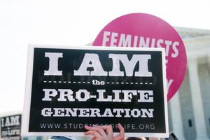 A pro-life demonstrator awaits the Supreme Court's ruling on abortion access in front of the Supreme Court in Washington, D.C., June 27, 2016.