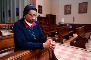 Democratic Republic of Congo's doctor and sister from the Christian community of the Redeemer Angel Bipendu prays in Alme church, in Lombardy region, on April 7, 2020.  