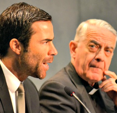 Rene Bruelhart (l), director of the Vatican’s Financial Information Authority, speaks at the Vatican Press Office.