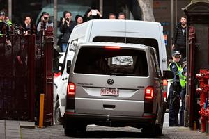 Australian Cardinal George Pell is driven away in a white prison van from the Supreme Court of Victoria in Melbourne on Aug. 21, 2019.