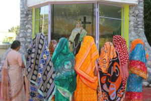 Wives of seven Christians, who were controversially convicted for the 2008 murder of  Hindu leader Swami Lakshmanananda Saraswati, pray Aug. 11 at Carmel convent in Balliguda, India.
