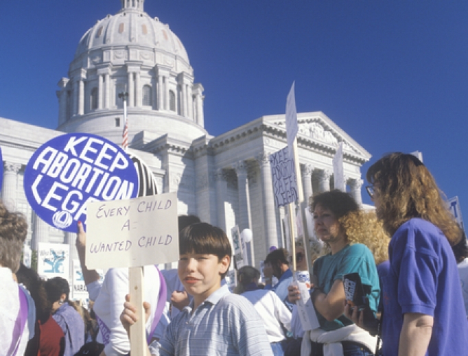 Women's rights marchers holding signs at State Capitol Building, Missouri, May 21, 2019.