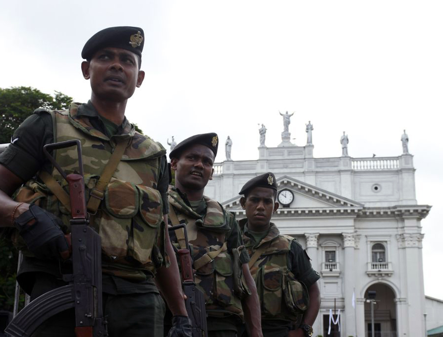 Sri Lankan Army soldiers stand guard at St. Lucia Cathedral during a May 11, 2019, Mass held for the victims of the Easter Sunday attacks in Colombo.
