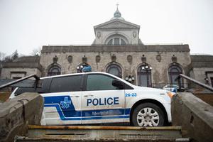 Police provide security at St. Joseph's Oratory in Montreal March 22, after Father Claude Grou was stabbed during a livestreamed morning Mass. The suspect was arrested at the basilica shortly after the attack in front of 50 people and a television audience around 8:40am, and Father Grou was taken to the hospital. 
