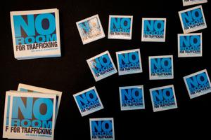 The "No Room for Trafficking" campaign logo is seen during a Jan. 9, 2020, meeting to prevent human trafficking in Miami, Florida — the site of Super Bowl LIV.