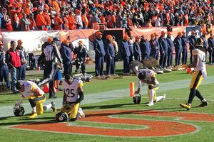 Pittsburgh Steelers kneel for higher reasons before a playoff game in Denver on January 17, 2016.