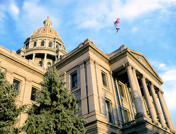 The Colorado State Capitol at dusk.