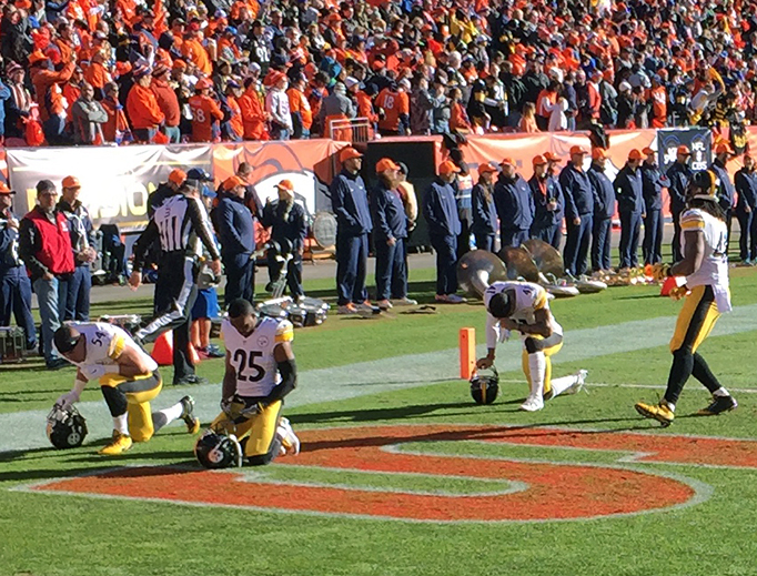 Pittsburgh Steelers kneel for higher reasons before a playoff game in Denver on January 17, 2016.