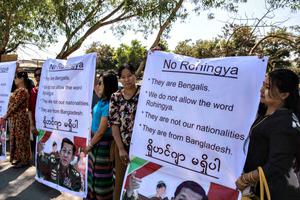 Ma Ba Tha Buddhists protest the use of the word 'Rohingya' as a Rakhine donation ship from Malaysia arrives Feb. 9 in Yangon, Burma. The Rohingya aid ship, Nautical Aliya, landed at Thilawa port near Yangon while making its way to the Rohingya refugee camps in Myanmar and Bangladesh, bearing 2,300 tons of food, clothes and medical supplies for the Rohingyas in the two countries. Below, Cardinal Charles Maung Bo of Myanmar has spoken with Pope Francis on alleviating the suffering of this Muslim minority.