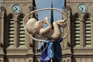 A model of a fetus is seen in front of the Basilica of the Virgin of Lujan, as the Argentine Catholic Church celebrates a March 8 Mass to pray for the rejection of the bill proposed by President Alberto Fernandez to decriminalizes abortion. 