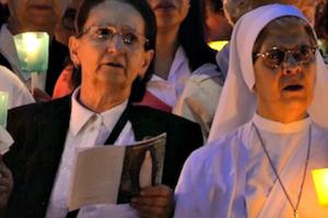 Pilgrims pray during a prayer vigil dedicated to the Virgin Mary in the Vatican Gardens on May 31.

