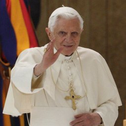 Pope Benedict XVI waves to pilgrims as he arrives for his general audience in Paul VI hall at the Vatican Nov. 10.
