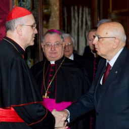 Cardinal Tarcisio Bertone, Vatican secretary of state, delivers Pope Benedict XVI's well wishes to Italian President Giorgio Napolitano at the Vatican March 16, the day before Italy marked the 150th anniversary of its unification. 
