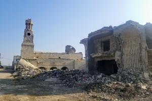 Above, Mosul’s destroyed Chaldean Catholic archbishopric is shown.
