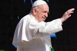 Pope Francis waves at pilgrims during his weekly General Audience, 2019.