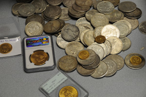 These are among the coins left in the care of the Blessed Mother at the National Shrine of Our Lady of Lourdes. 