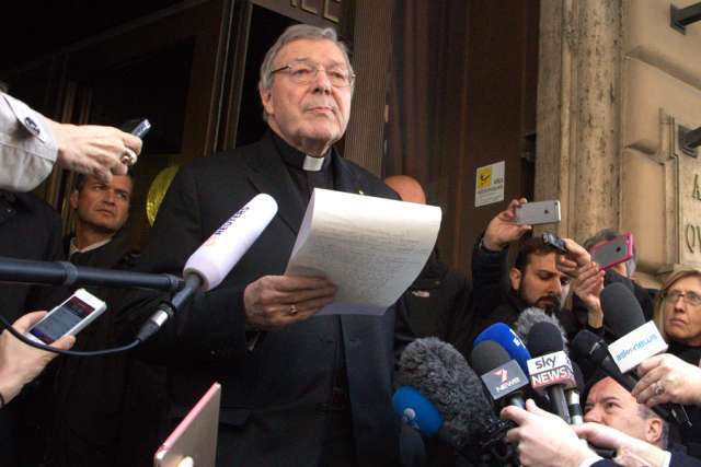Cardinal George Pell, prefect of the economy secretariat, speaks to reporters outside Rome's Hotel Quirinale after meeting with sex-abuse survivors March 3, 2016. 