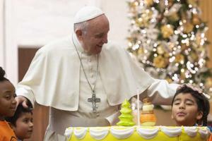 Pope Francis celebrates his 82nd birthday a day early with young patients of the Santa Marta Pediatric Dispensary Dec. 16. 