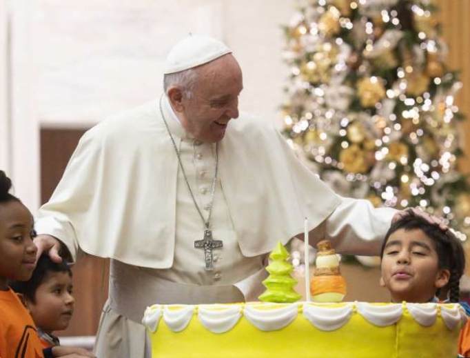 Pope Francis celebrates his 82nd birthday a day early with young patients of the Santa Marta Pediatric Dispensary Dec. 16. 