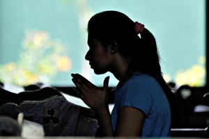 A Sri Lankan Catholic prays at a church in the capital city of Colombo.