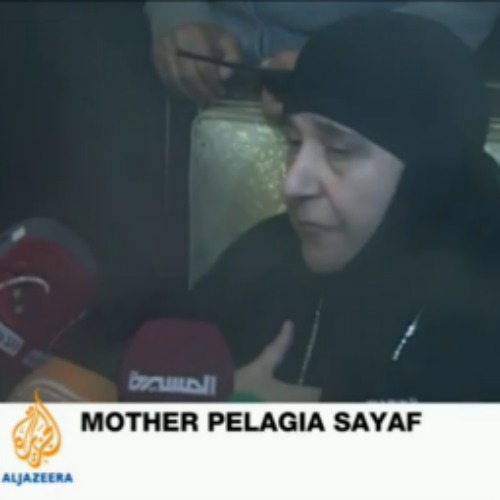 Mother Pelagia Sayaf of the St. Thekla Convent in Ma’loula, Syria, speaks with reporters March 10 following her release after being held for three months in captivity by Syrian rebels.