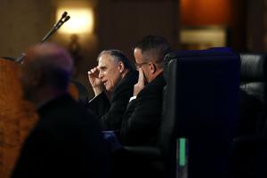 Cardinal Daniel DiNardo, president of the USCCB, left, at the USCCB's annual fall meeting Tuesday in Baltimore. 