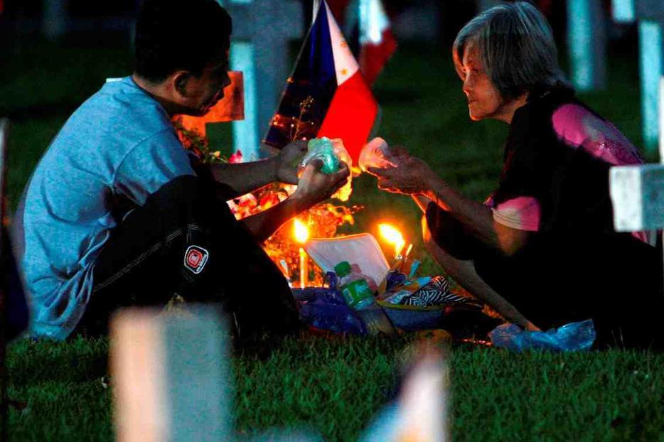 All Saints Day prayers in Manila.