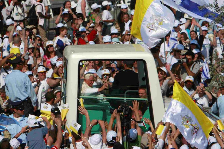 A throng greets the Pope yesterday.