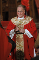 Archbishop Timothy Dolan distributes Communion today at St. Patrick's Cathedral in New York.
