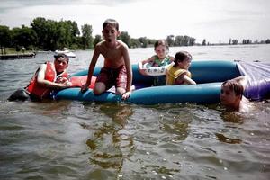 Tyler (left, in the life vest) and his family