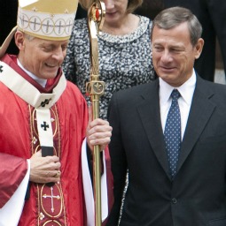 Cardinal Donald Wuerl of Washington walks with John Roberts’ chief justice of the U.S. Supreme Court as they leave St. Matthew cathedral after attending the Red Mass Oct. 2 in Washington.