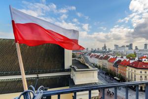 Polish flag waving near Warsaw's city center. 