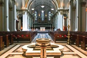 SACRED SEATTLE. The interior of St. James includes a painting of Mary, Jesus and saints dating to the 15th century and other Marian icons and statues.