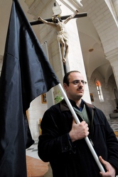 Palestinian man processes in Bethlehem Jan. 4 for peace in Gaza.