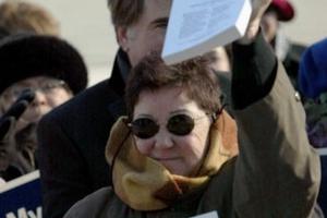 Norma McCorvey, the former Roe of Roe v.Wade, holds up a copy of her petition on the steps of the U.S. Supreme Court on January 18, 2005 in Washington, DC. 
