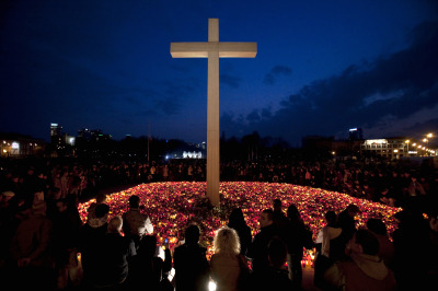 A NATION GRIEVES. Poles light candles next to a cross at Pilsudski Sqare in Warsaw April 11, 2010, the feast of Divine Mercy. President Lech Kaczynski's coffin returned home to a stunned nation on Sunday, a day after he and much of the country's political and military elite perished in a plane crash in Russia. 