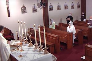 GATHERING IN PRAYER. Mass is social distanced at EWTN on July 31. 