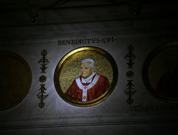 The icon of Pope Benedict XVI is lit inside the Basilica of St. Paul Outside the Walls in Rome, Feb. 11, 2013. Pope Benedict XVI that day announced he would become the first pontiff in 600 years to resign. 
