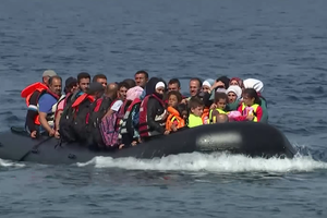 Refugees arriving in Lesbos on an overloaded dingy last September.