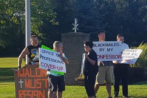 Above, laity participate in a lay-organized protest outside Christ the King Seminary in East Aurora, New York, Aug. 28. 