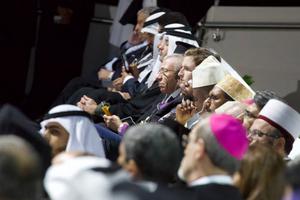 Archbishop Pierbattista Pizzaballa (foreground), apostolic administrator of the Latin Patriachate of Jerusalem, sits among followers of other religions at interreligious meeting in Abu Dhabi, Feb. 4, 2019.