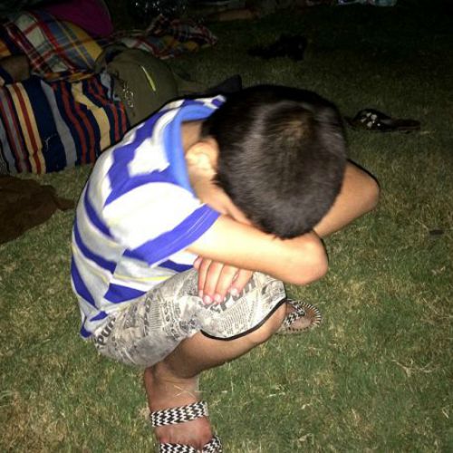 A young refugee rests after having fled from ISIS and arriving in Ankawa in the northern part of Erbil, Iraq.
